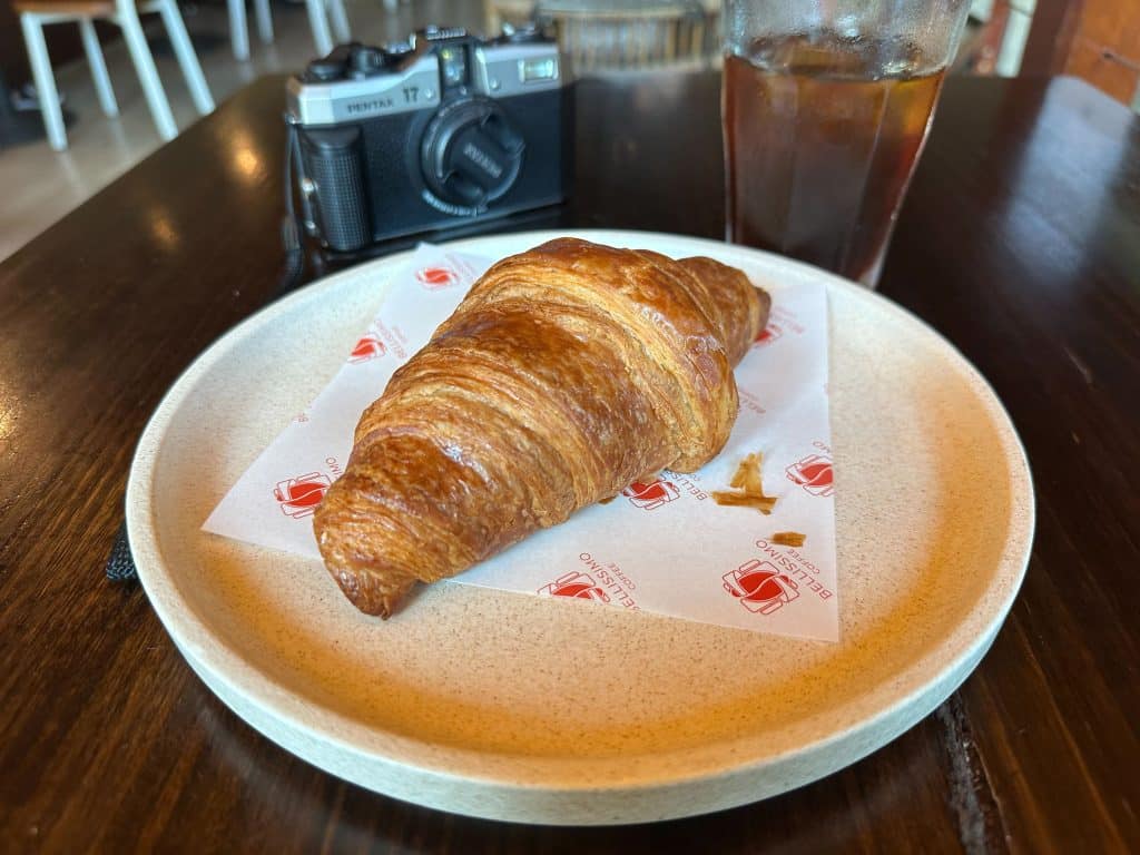 Bellissimo Coffee Fortitude Valley. Eating a tasty croissant with my Pentax 17 (still feel odd not having my trusty Olympus OM4-Ti)