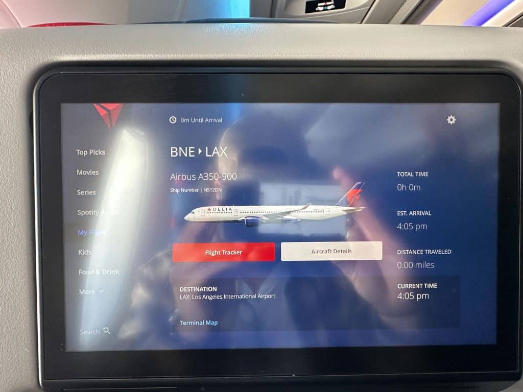 Delta Air Lines A350 in-flight screen showing BNE to LAX route, arrival at Los Angeles International Airport at 4:05 PM.