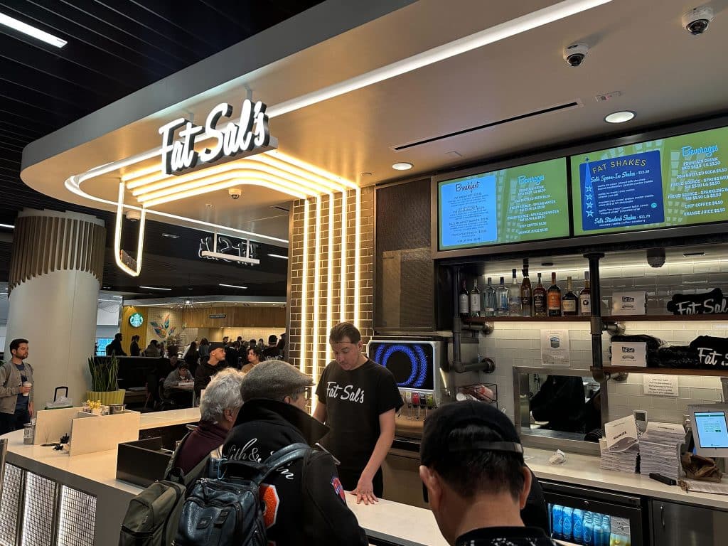 Fat Sal’s restaurant counter inside LAX Terminal 1 serving breakfast burritos, hot sandwiches, and shakes to travelers.