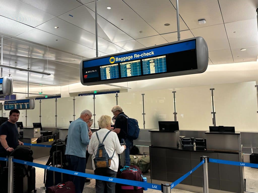 Delta baggage re-check area at LAX for passengers continuing domestic flights after customs.