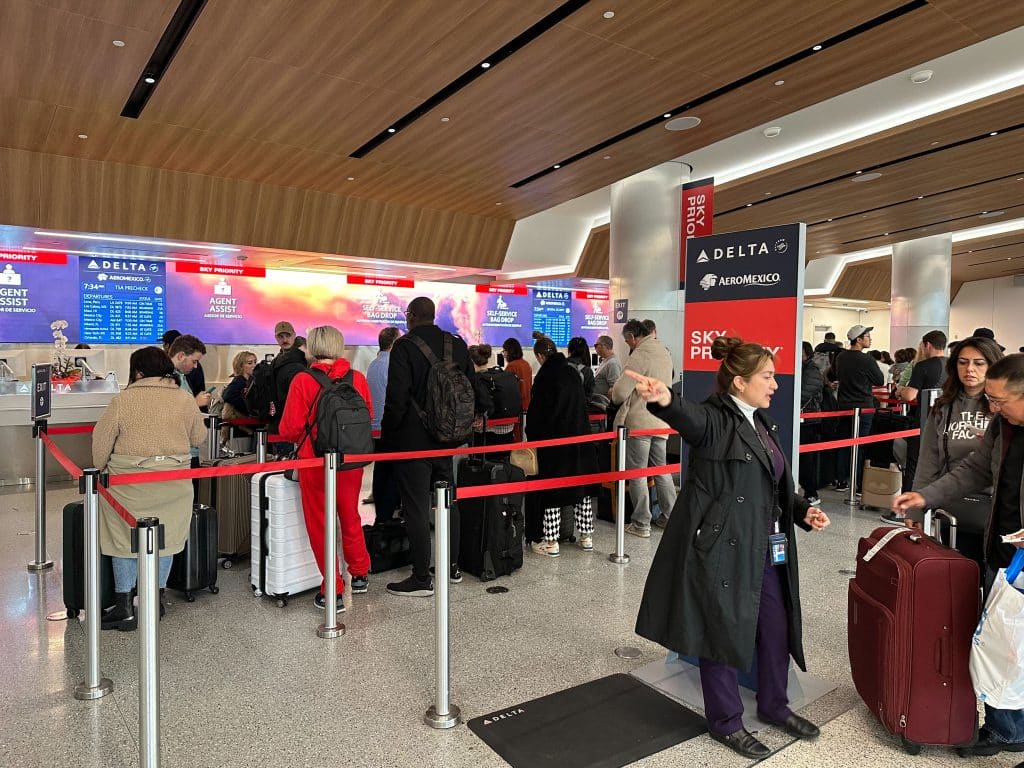 Delta Sky Priority check-in queue at LAX Terminal 3 with signage for Aeromexico partnership.